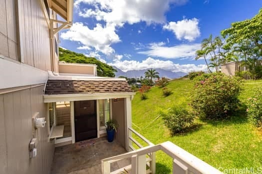 view of yard featuring a balcony