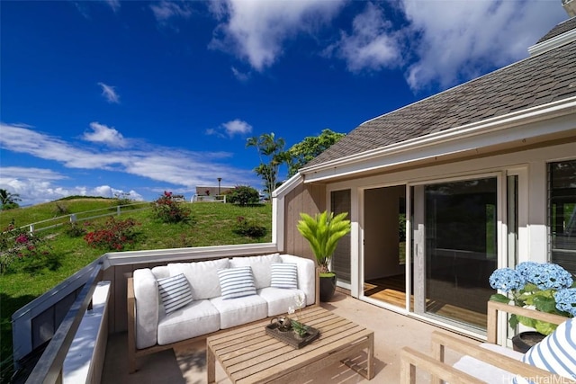 wooden terrace featuring an outdoor living space