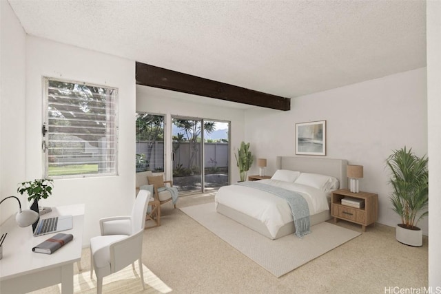 carpeted bedroom with a textured ceiling, access to outside, and beam ceiling