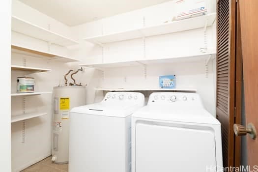 laundry area with washer and dryer, laundry area, and electric water heater