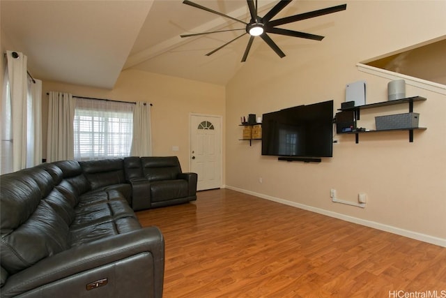 living room with ceiling fan, high vaulted ceiling, wood finished floors, and baseboards