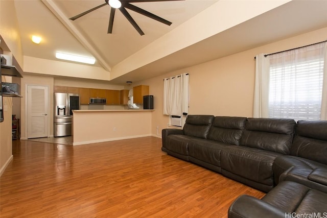 living room with light wood-style floors, ceiling fan, baseboards, and high vaulted ceiling