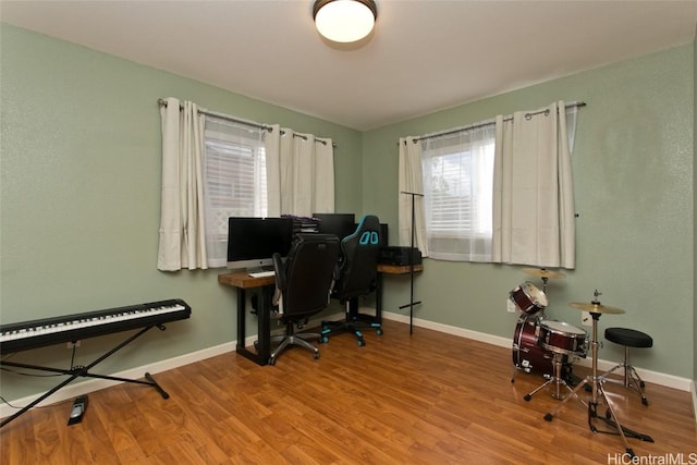 office area with wood finished floors and baseboards