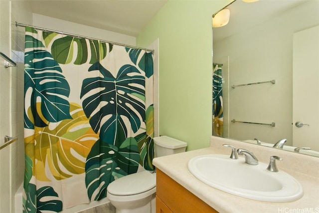 full bathroom with vanity and toilet