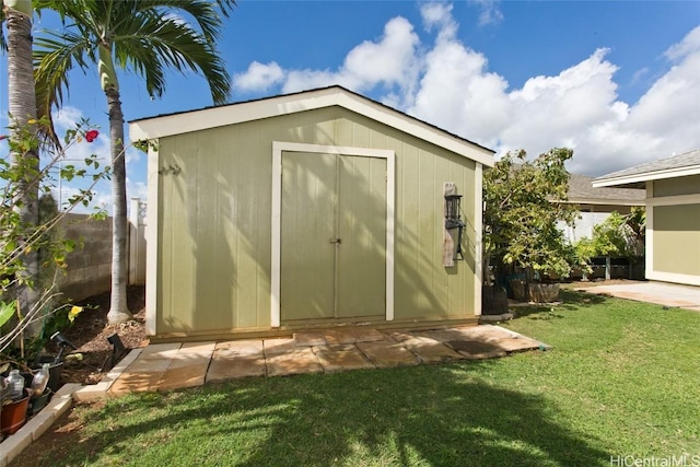 view of shed with fence