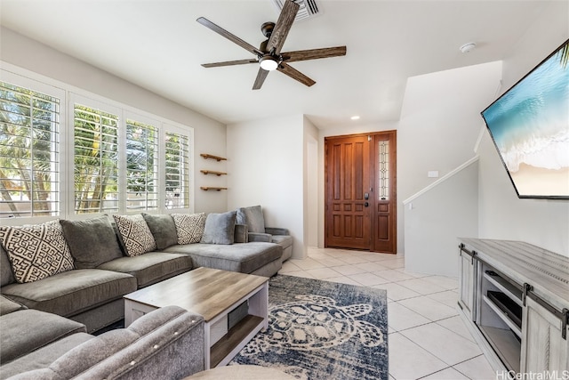 living room featuring a ceiling fan, recessed lighting, visible vents, and light tile patterned floors