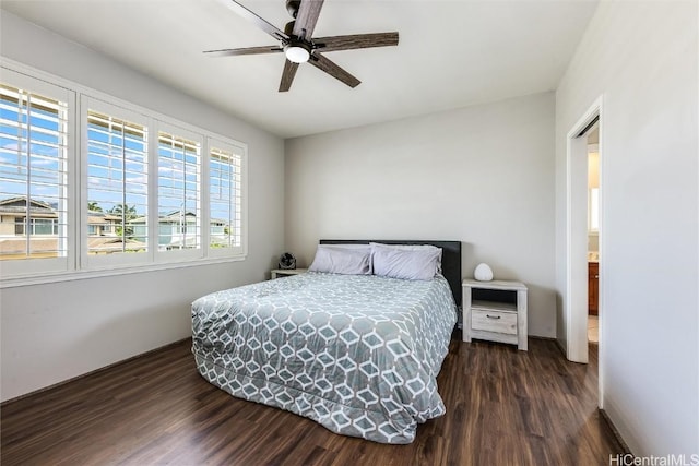 bedroom featuring dark wood finished floors and a ceiling fan