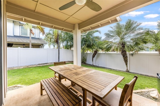 view of patio with ceiling fan, outdoor dining area, and a fenced backyard