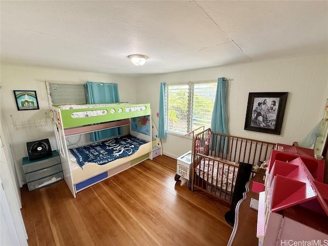 bedroom with wood finished floors