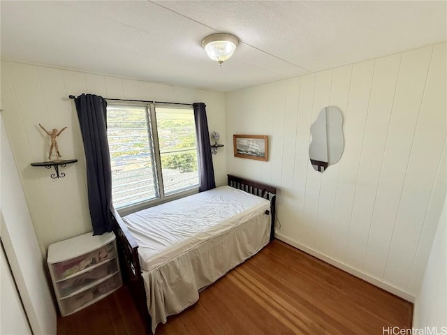 bedroom with wood finished floors