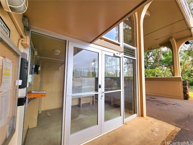 exterior space with a healthy amount of sunlight and french doors