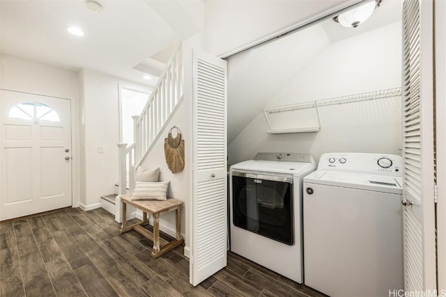 laundry room with recessed lighting, wood tiled floor, washing machine and dryer, and laundry area