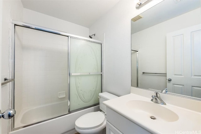 full bathroom featuring shower / bath combination with glass door, visible vents, toilet, and vanity