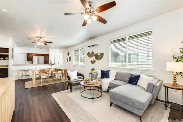 living area with recessed lighting, a ceiling fan, dark wood-type flooring, and a wall unit AC