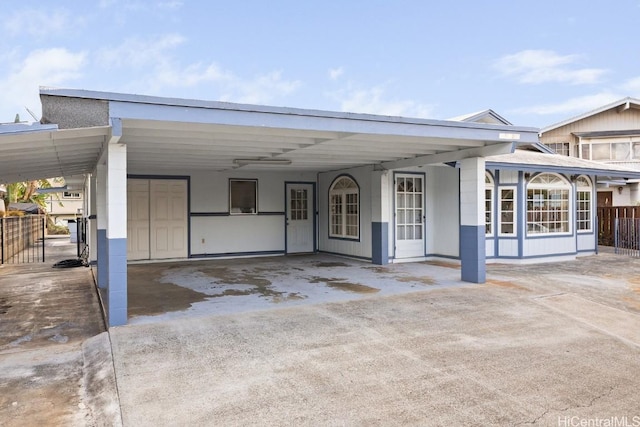 94-1377 Hiaai Pl, Waipahu, HI 96797 - view of front of home with driveway, an attached carport, and fence