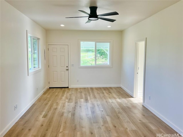 empty room with a ceiling fan, light wood-style flooring, recessed lighting, and baseboards