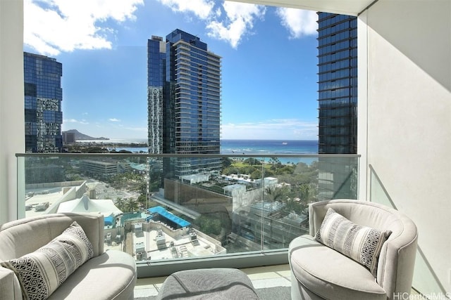 balcony with a view of city and a water view