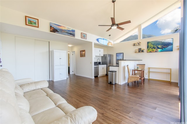 84-754 Ala Mahiku St Unit 31C, Waianae, HI 96792 - living area with baseboards, a ceiling fan, dark wood-style flooring, and high vaulted ceiling