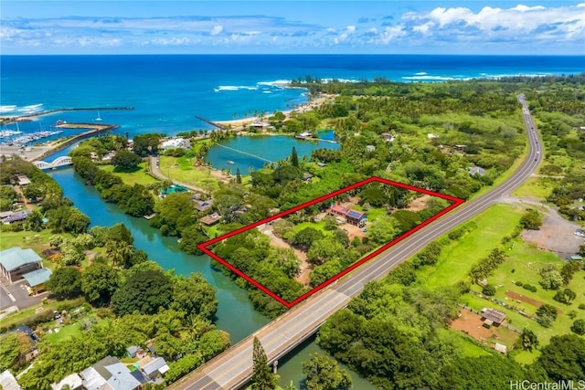 birds eye view of property with a water view