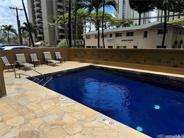 pool featuring a patio area