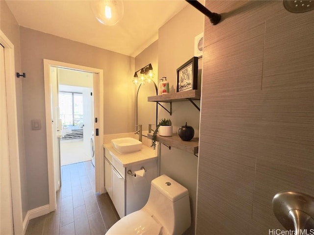 bathroom with toilet and vanity