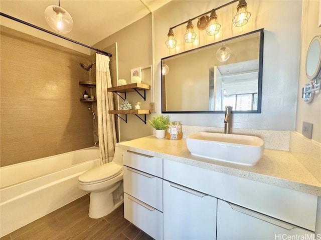 bathroom featuring shower / bathtub combination with curtain, toilet, vanity, and wood finished floors