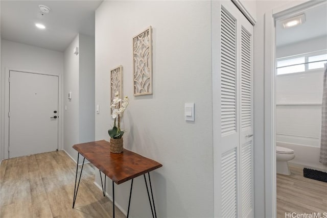 hall with light wood-style floors