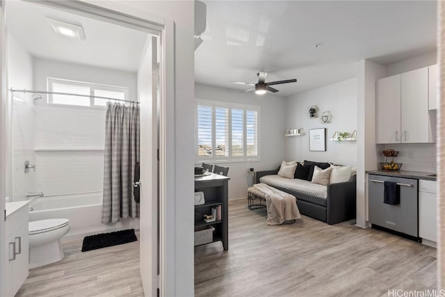 interior space with light wood-style flooring and a ceiling fan