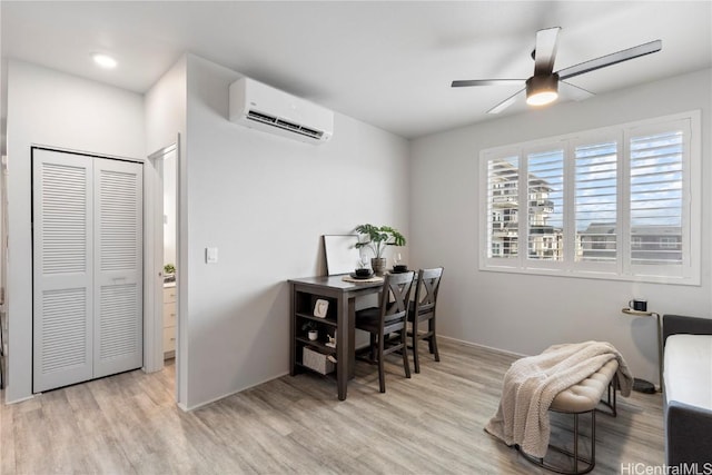 office area with a wall unit AC, wood finished floors, a ceiling fan, and recessed lighting