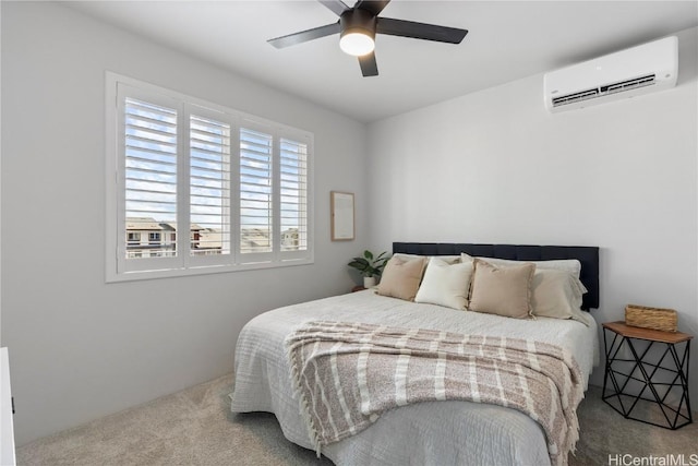 carpeted bedroom featuring a wall unit AC and a ceiling fan