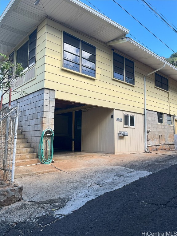 exterior space featuring driveway and a carport