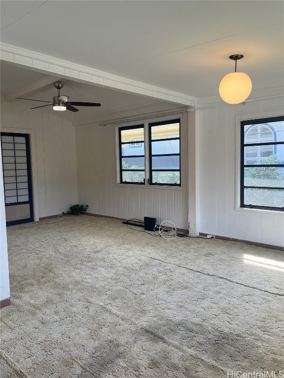 empty room with plenty of natural light and ceiling fan