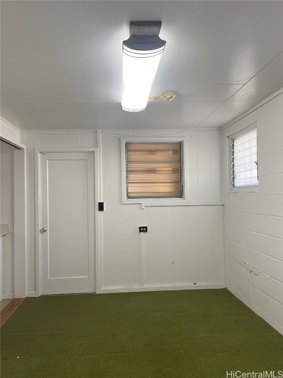 unfurnished room with carpet flooring