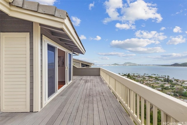 wooden deck featuring a water view