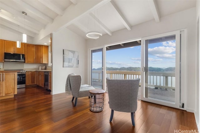 dining area with a water view, dark wood finished floors, and lofted ceiling with beams