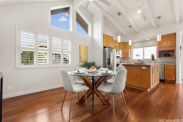 dining area with dark wood-style flooring, beamed ceiling, high vaulted ceiling, and baseboards