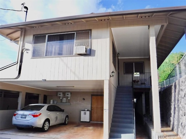 view of front facade with stairs and cooling unit