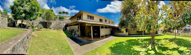 exterior space featuring a lawn, a patio, and fence