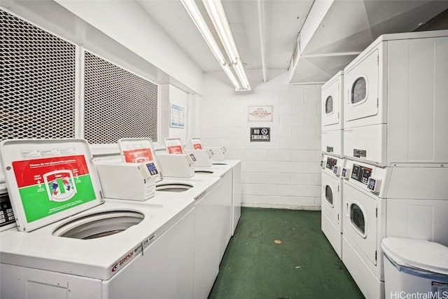 common laundry area with separate washer and dryer and stacked washer / drying machine