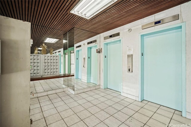 interior space featuring elevator and tile patterned flooring