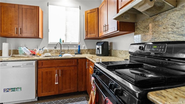 kitchen with electric range, brown cabinetry, dishwasher, under cabinet range hood, and a sink