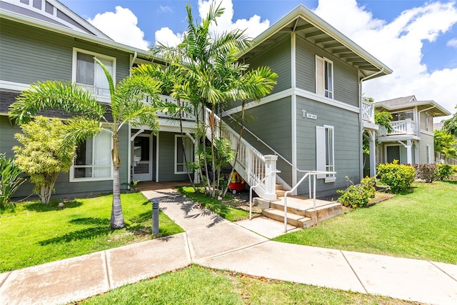 91-1058 Kekuilani Loop Unit 1804, Kapolei, HI 96707 - view of front of home featuring a front lawn and covered porch