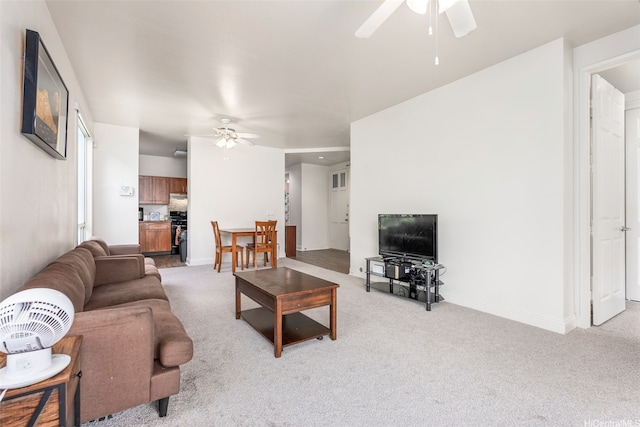 91-1058 Kekuilani Loop Unit 1804, Kapolei, HI 96707 - living area with light carpet, a ceiling fan, and baseboards
