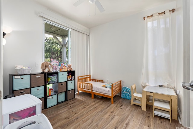91-1058 Kekuilani Loop Unit 1804, Kapolei, HI 96707 - bedroom with ceiling fan and wood finished floors