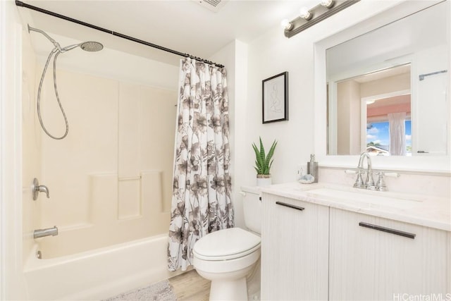 full bathroom with toilet, wood finished floors, shower / tub combo with curtain, and vanity