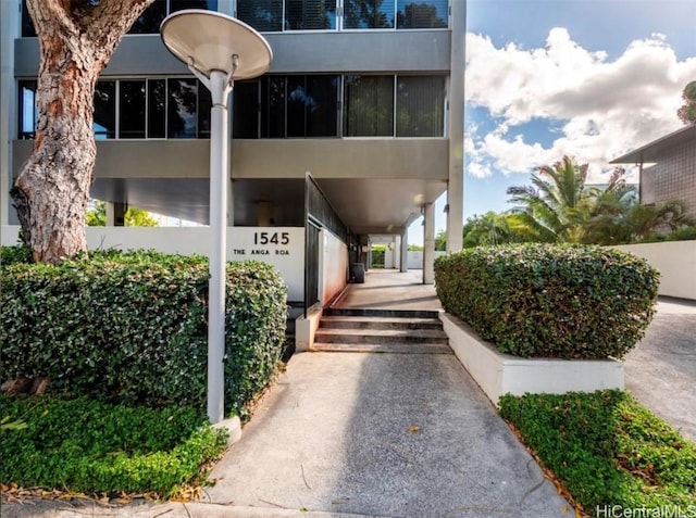 view of property featuring stairway