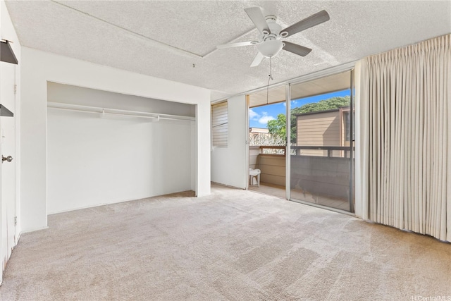 94-414 Kapuahi St Unit 23, Honolulu, HI 96789 - unfurnished bedroom with access to outside, a textured ceiling, carpet floors, a closet, and ceiling fan