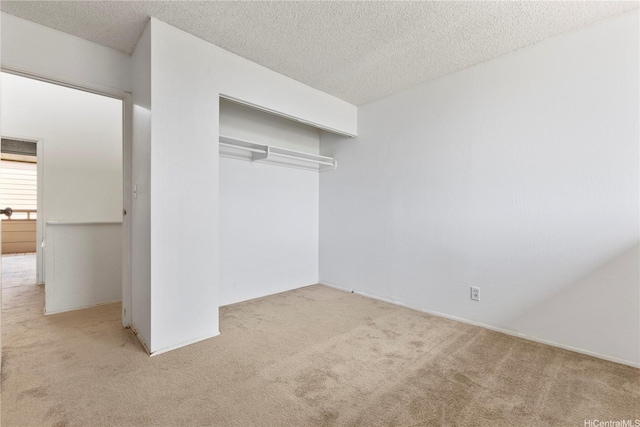 94-414 Kapuahi St Unit 23, Honolulu, HI 96789 - unfurnished bedroom featuring carpet, a closet, and a textured ceiling