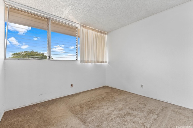 94-414 Kapuahi St Unit 23, Honolulu, HI 96789 - carpeted empty room featuring plenty of natural light and a textured ceiling