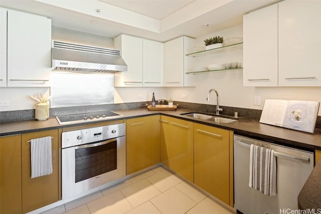 kitchen with open shelves, dark countertops, appliances with stainless steel finishes, a sink, and ventilation hood